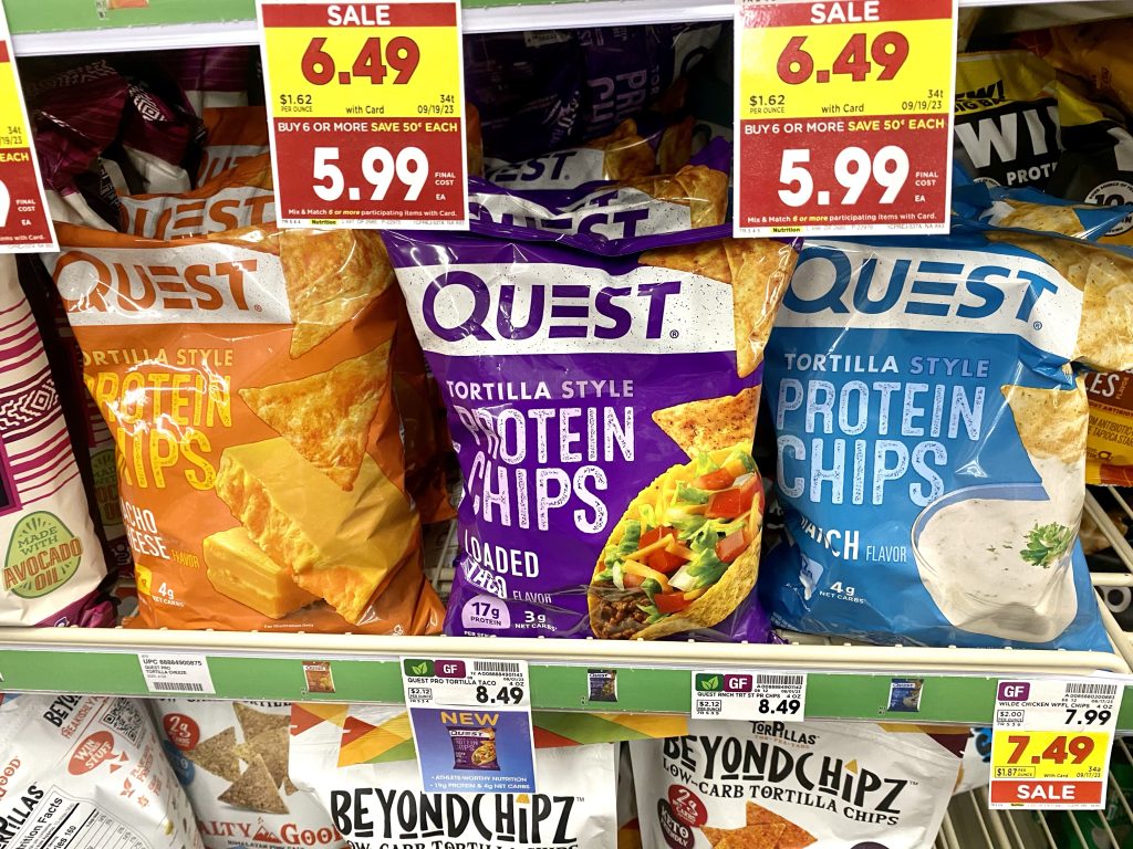 Packages of protein chips on store shelf.