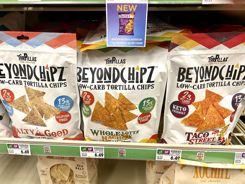 bags of low carb chips on a store shelf.