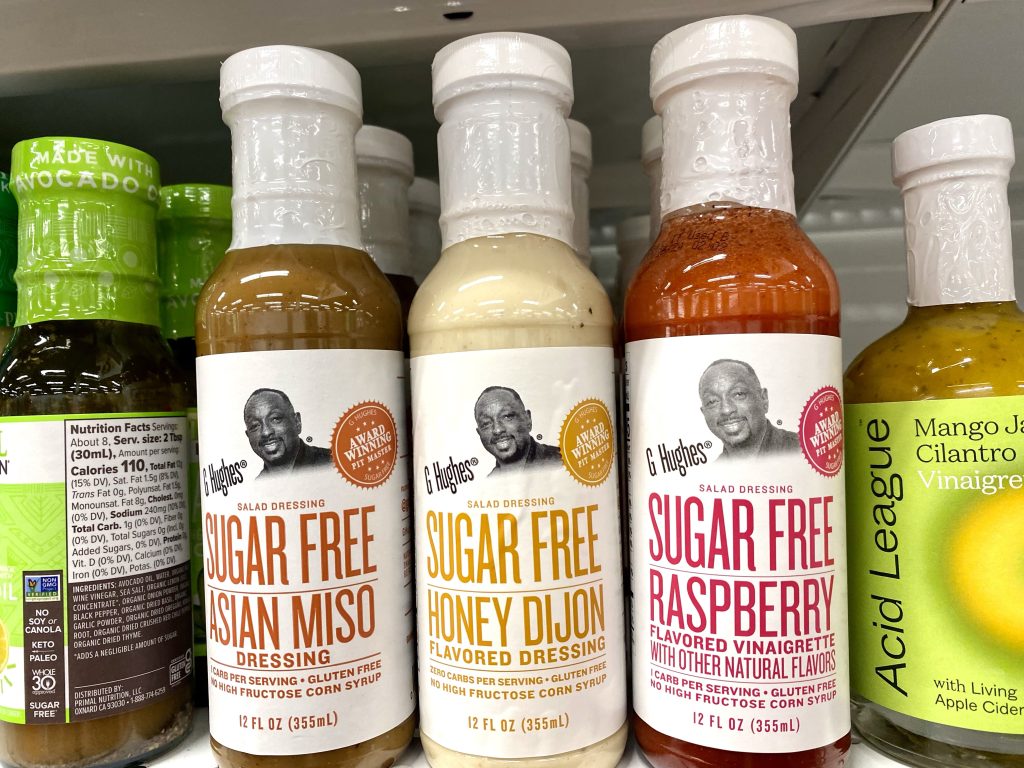 Bottles of sugar free salad dressing on store shelf.