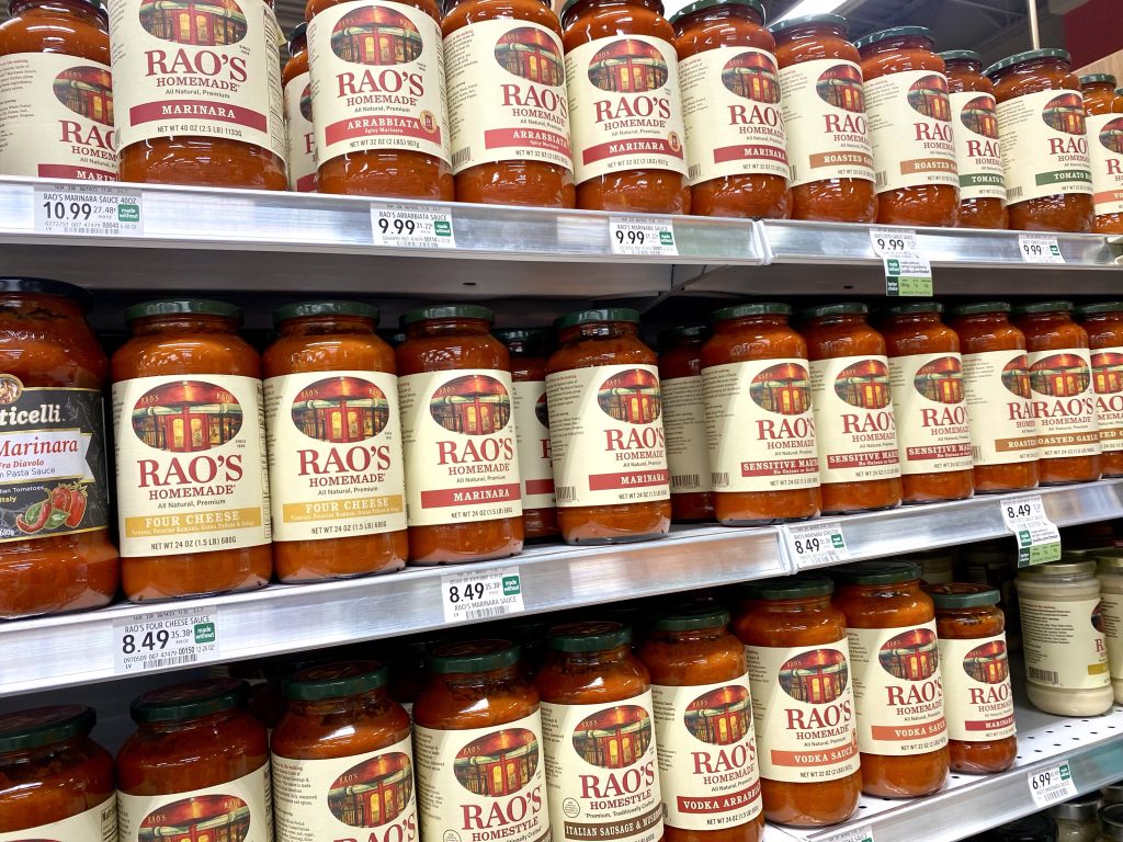 Jars of Rao's marinara on grocery shelf.