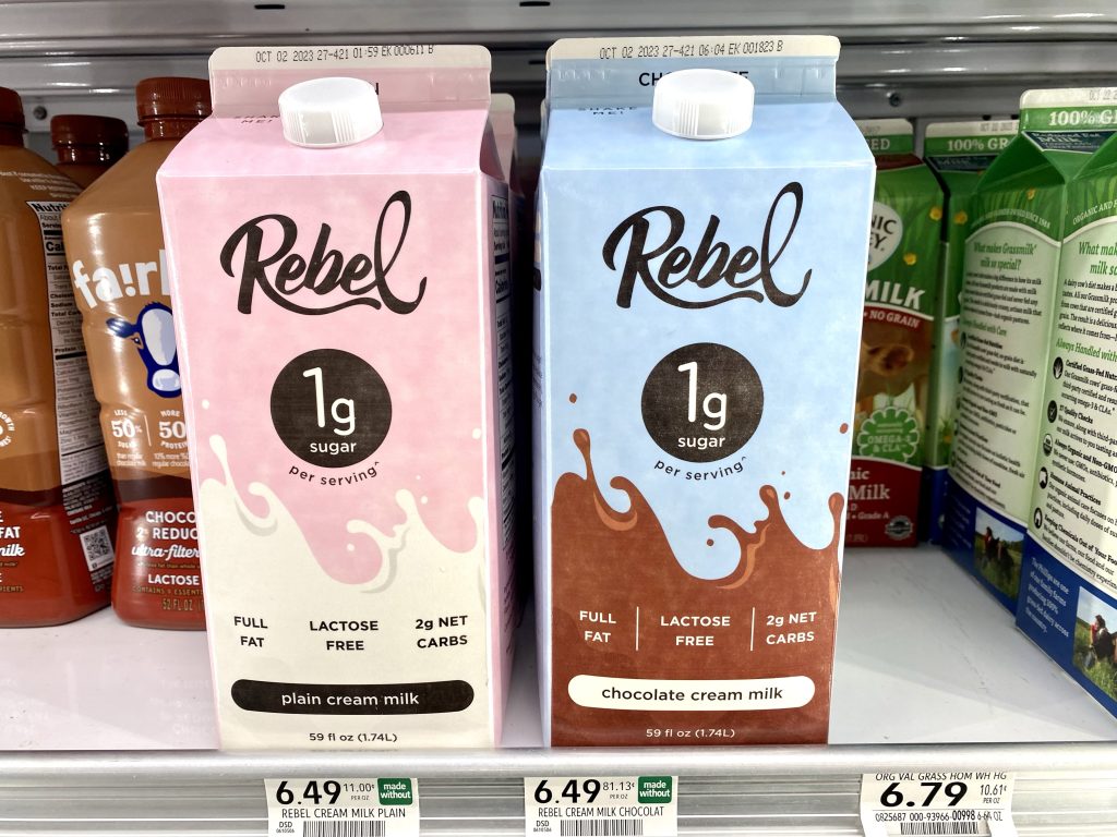 Keto milk and chocolate milk in refrigerated cooler of grocery store.
