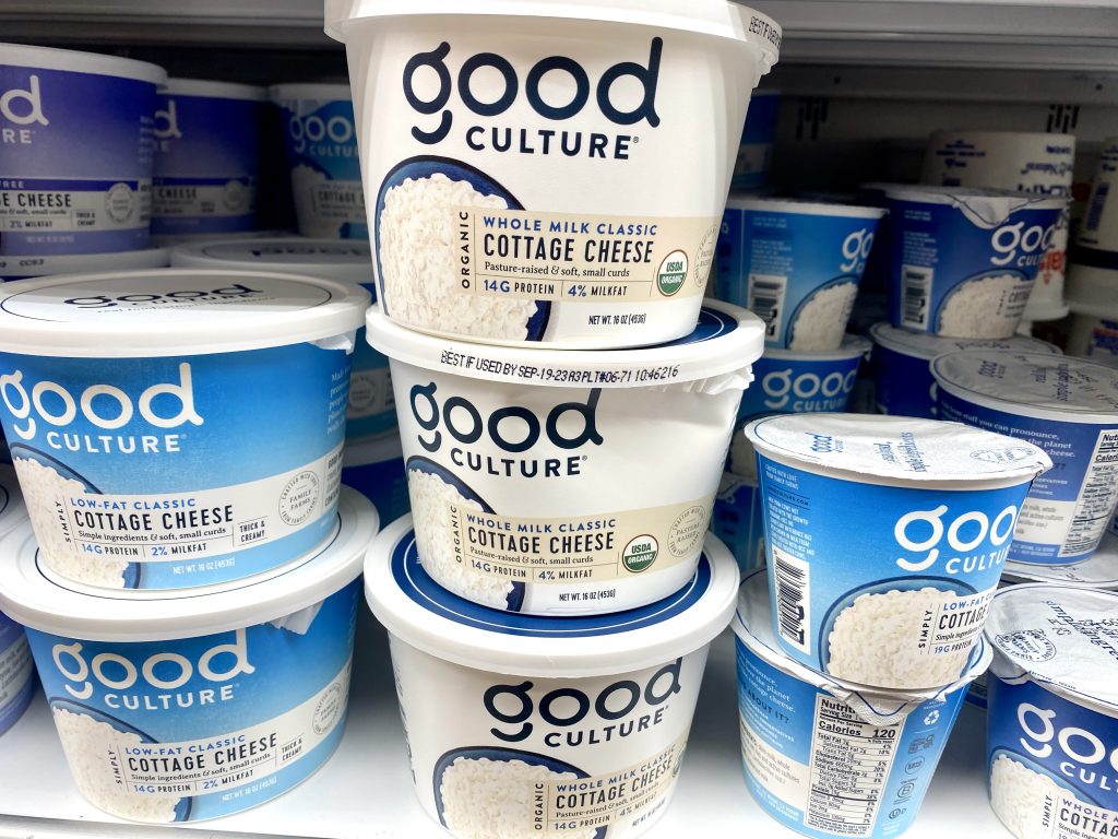 Good Culture cottage cheese in the refrigerated cooler at grocery store.