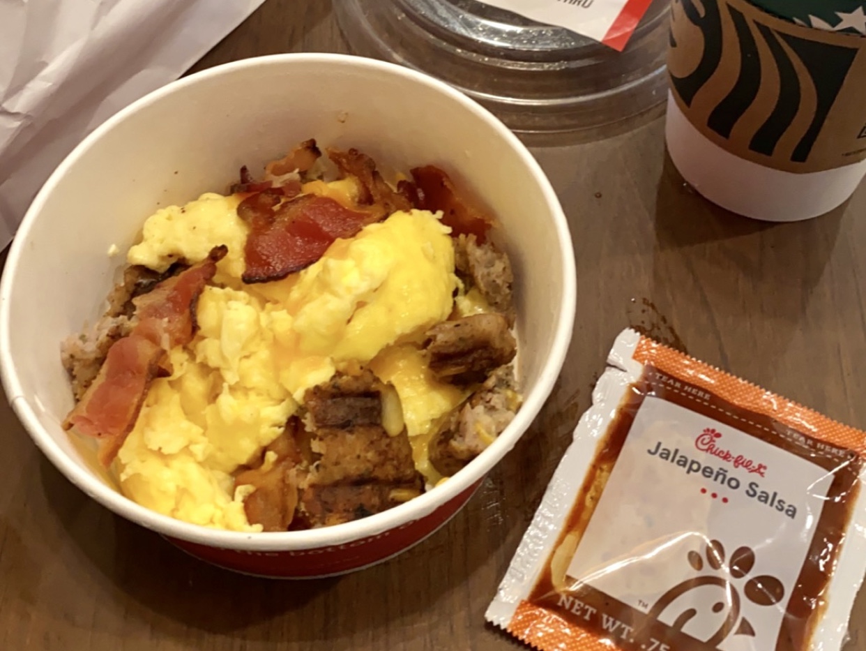 A breakfast bowl from Chick-fil-a, sausage, bacon and scrambled eggs.