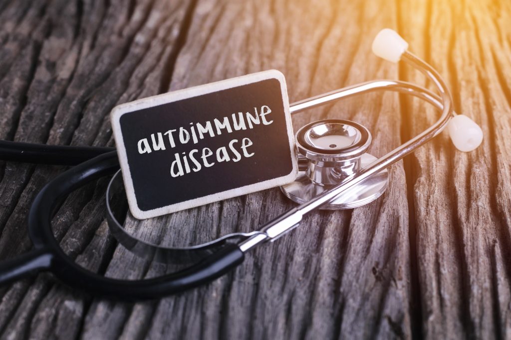 A plaque that reads autoimmune disease. It's beside a stethoscope. 