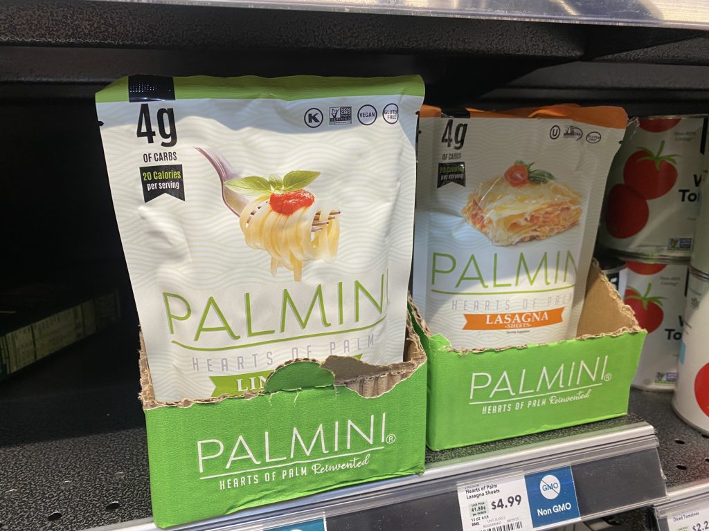 Packages of hearts of palm noodles on the shelf at the grocery.