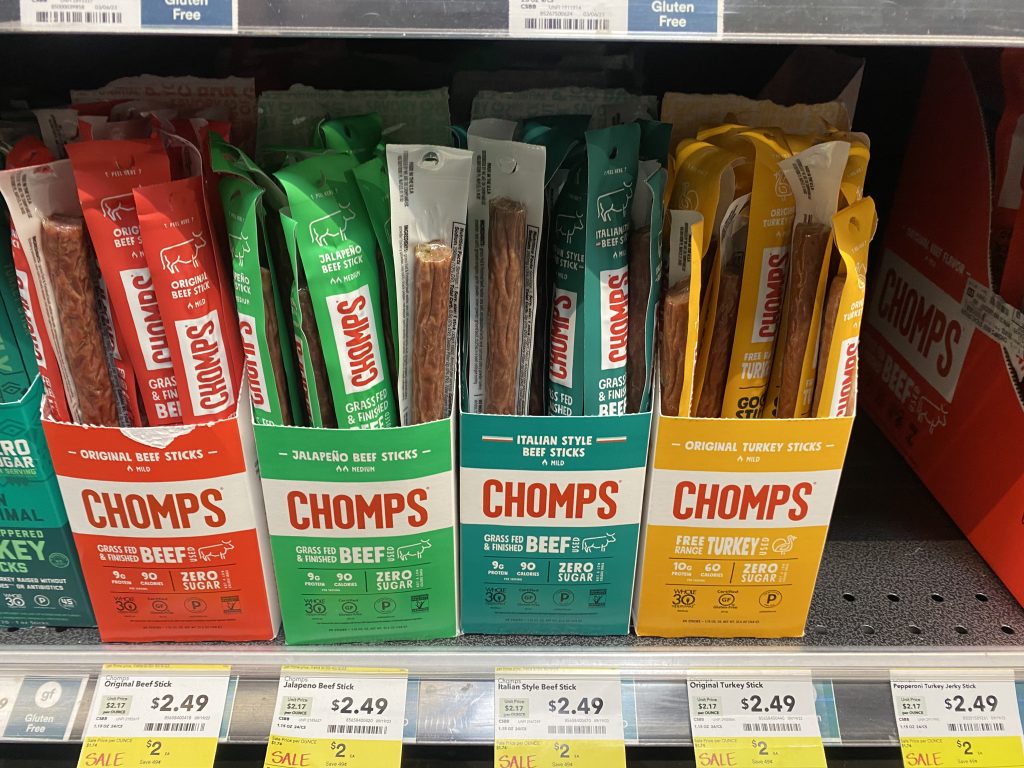 Boxes of beef sticks on the shelf at the grocery.