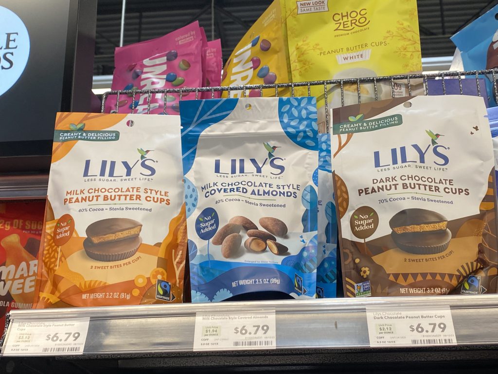 Bags of Lilys sugar free candy on the shelf at the grocery.