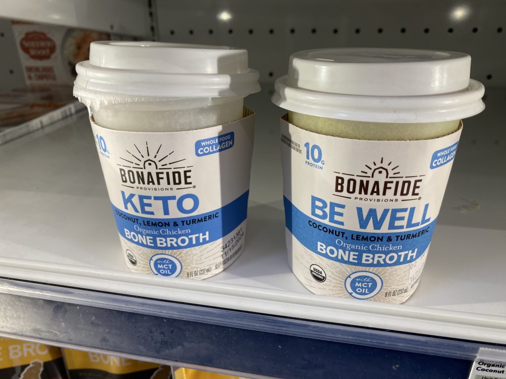 Cups of keto bone broth in the freezer section of the grocery.