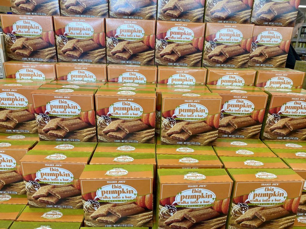 Boxes of pumpkin cereal bars on shelf at grocery.