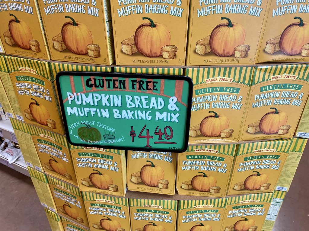 Boxes of Pumpkin bread mix on shelf at grocery.
