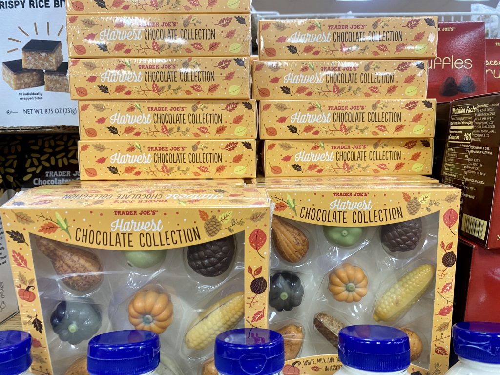 Boxes of chocolates that are filled with autumn shapes at grocery.