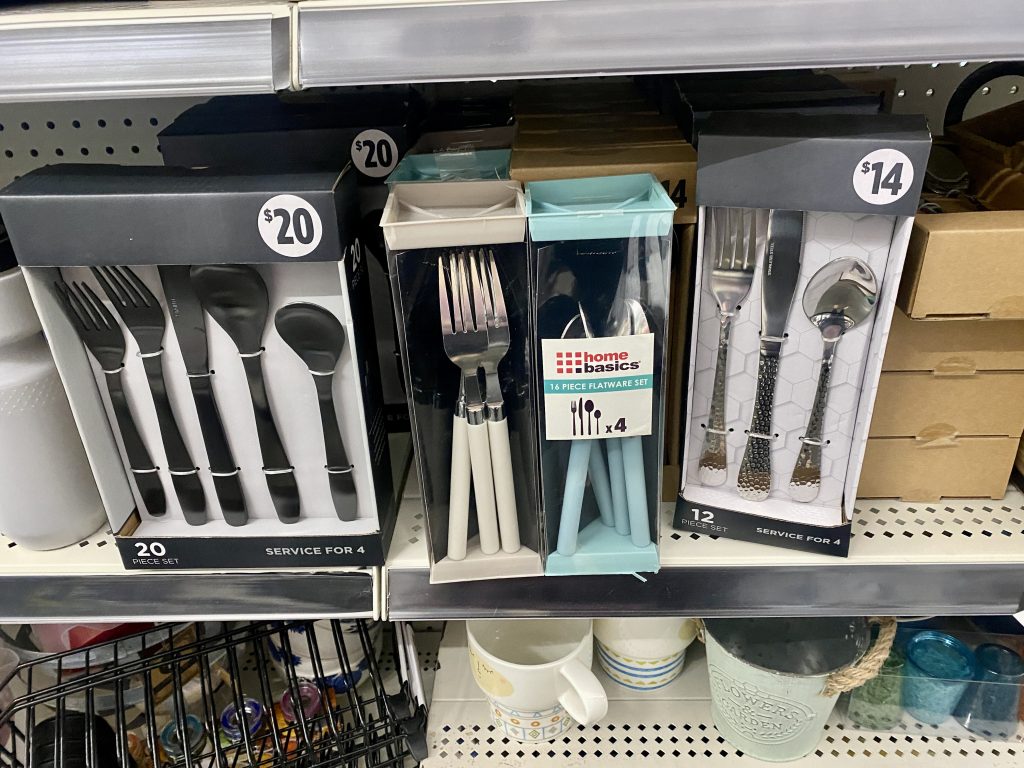 Several styles of cutlery on store shelf.