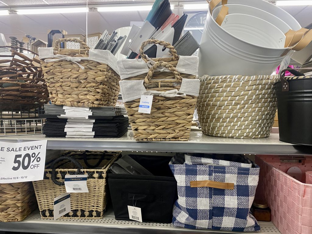 Decorative baskets on store shelf.