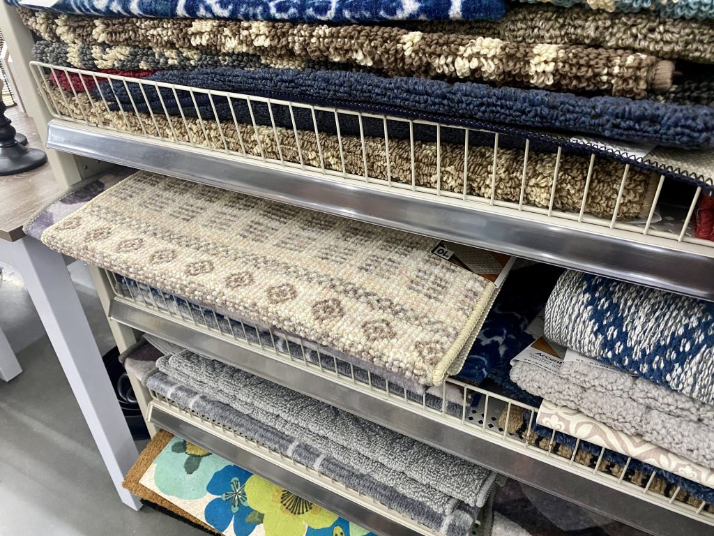 Rugs on store shelf.