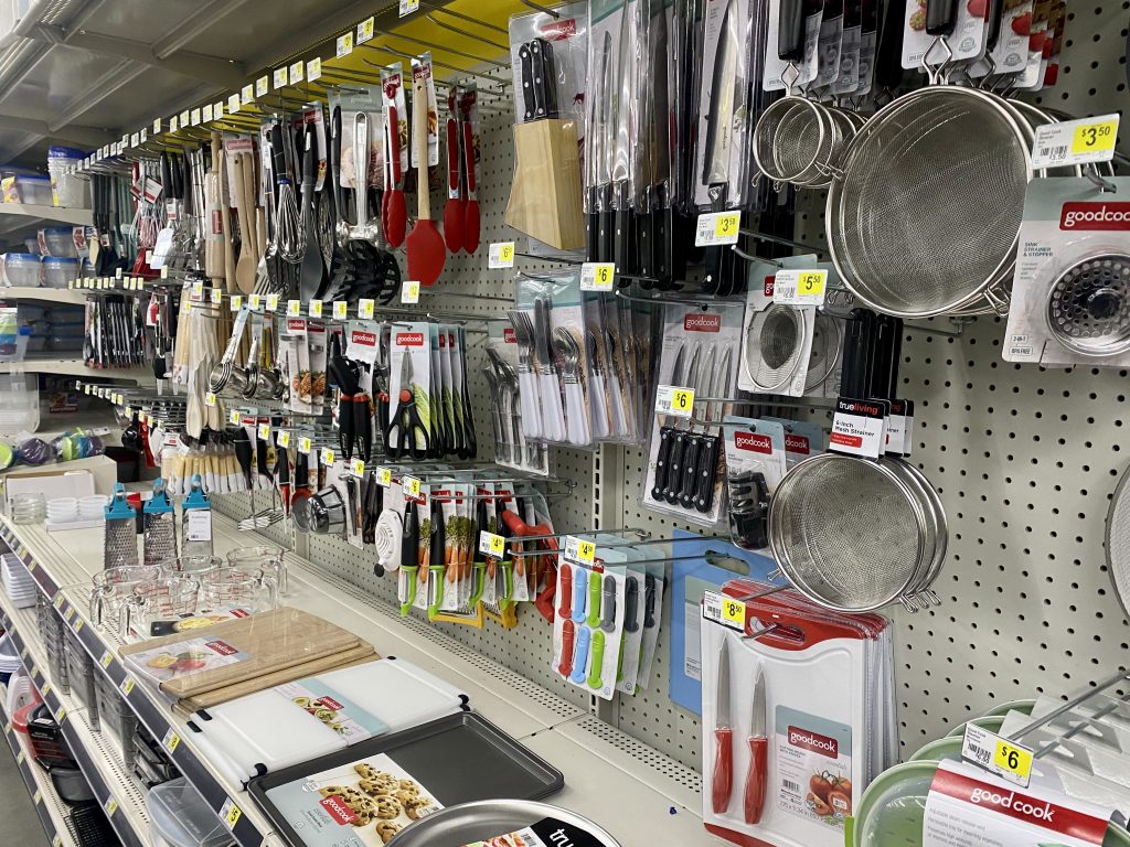 Kitchen tools and gadgets on store shelf.