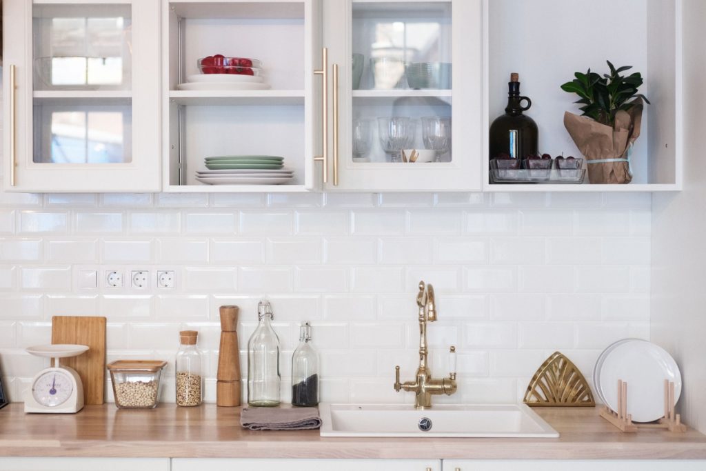 A white and cozy accessorized kitchen.