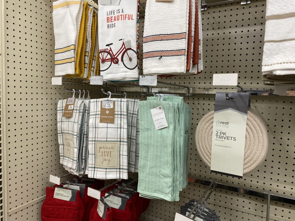 Hand towels for sale on store shelf.