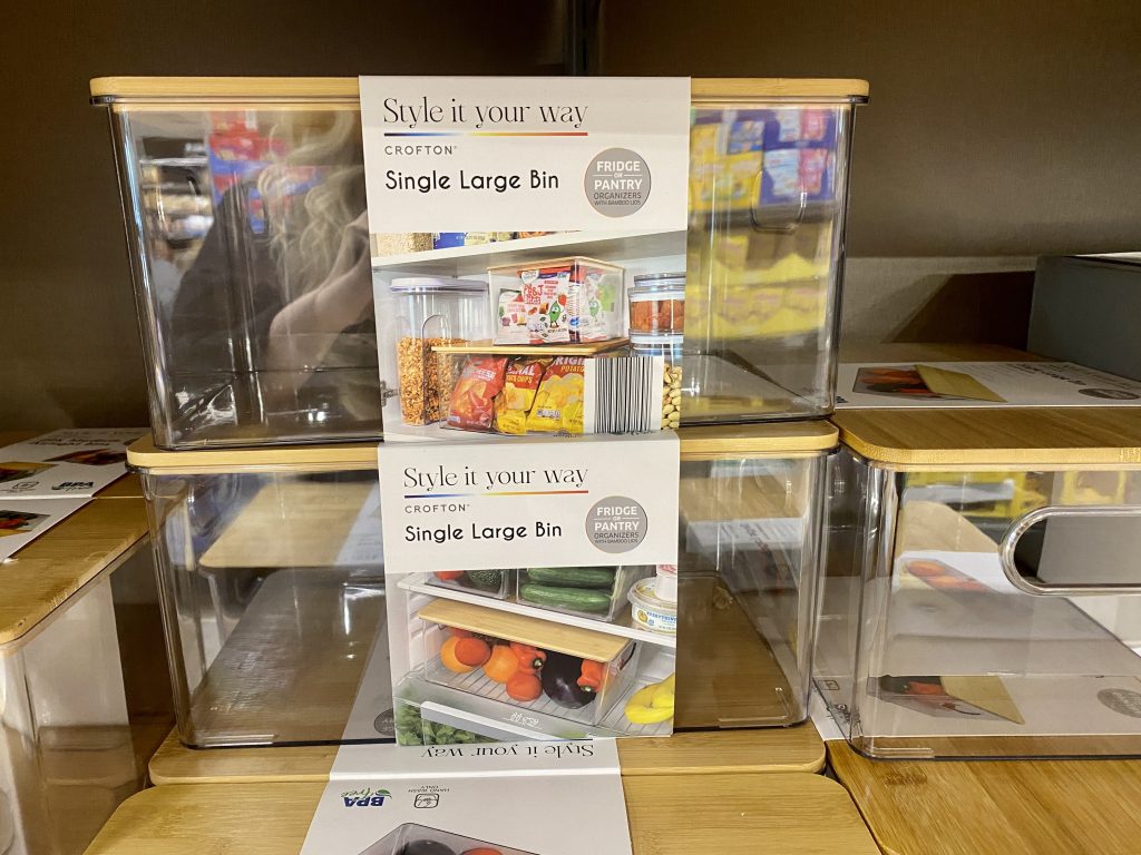 plastic and wood storage bins for sale at store.