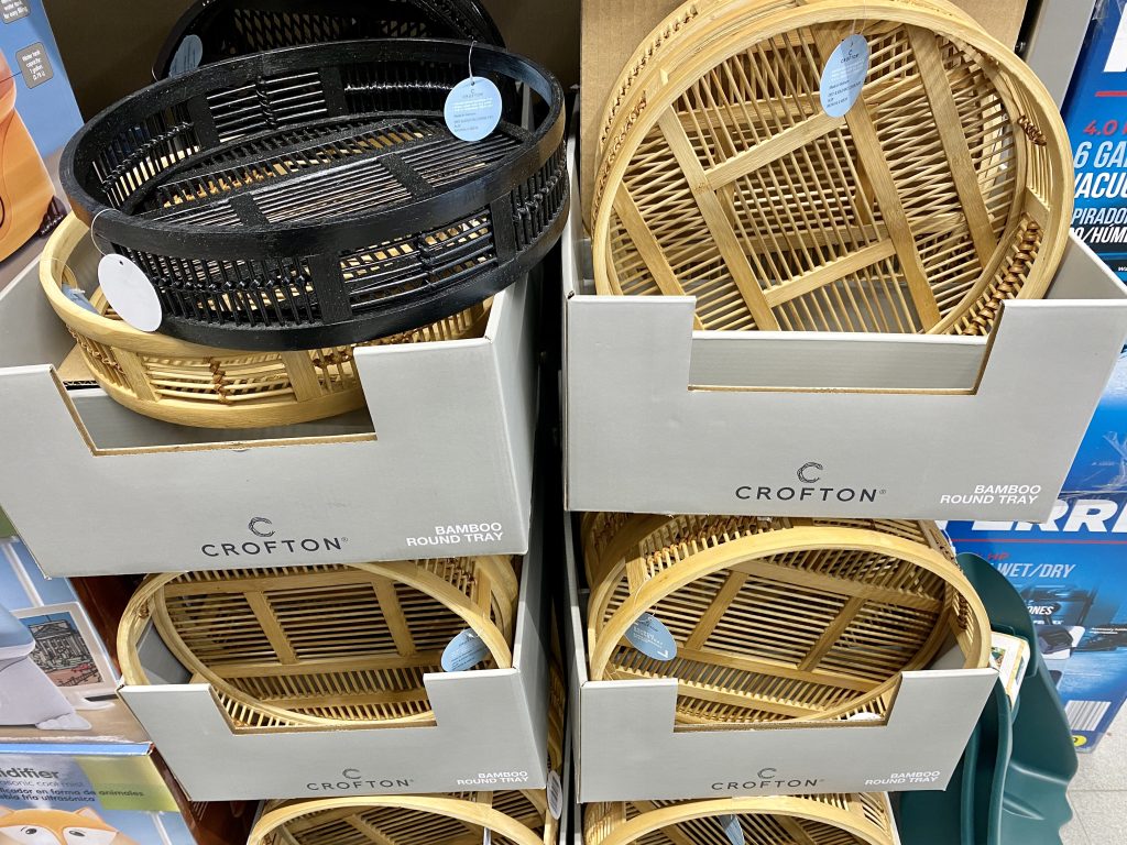 Bamboo trays for sale on store shelf.