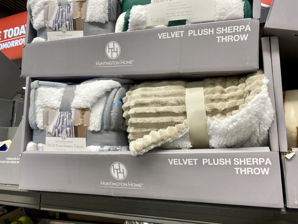 plush throws for sale at store.