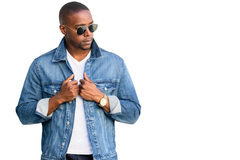 Man wearing a jean jacket and white tshirt. 