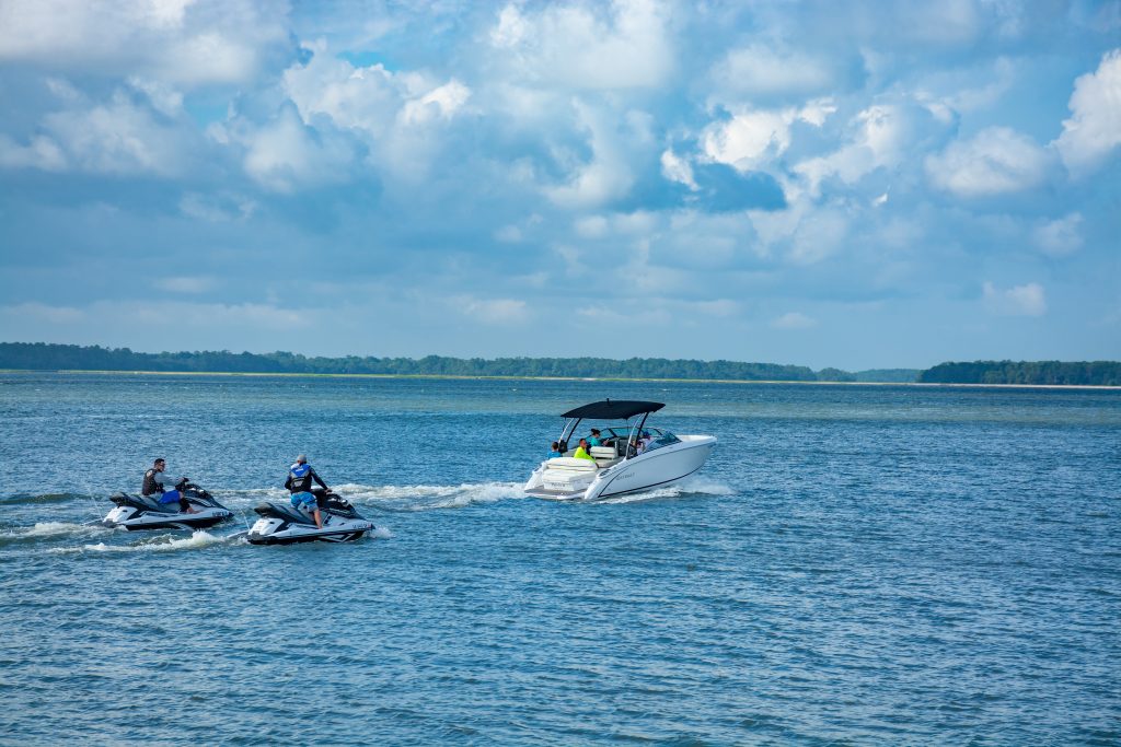 boat and jet ski in the water.