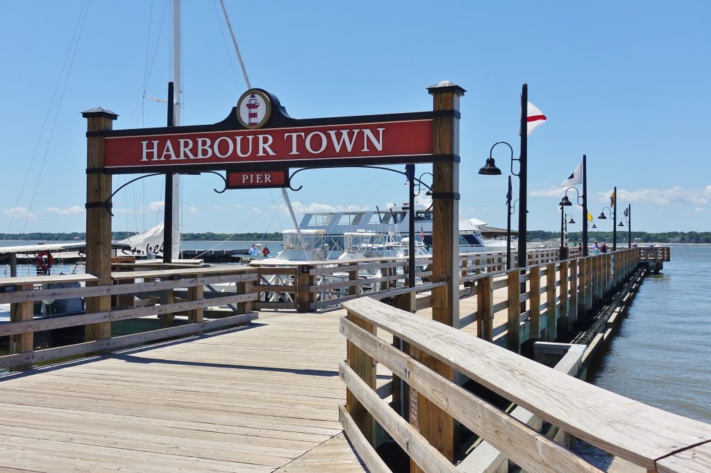 Pier, water and boats at harbour town hilton head island, sc.