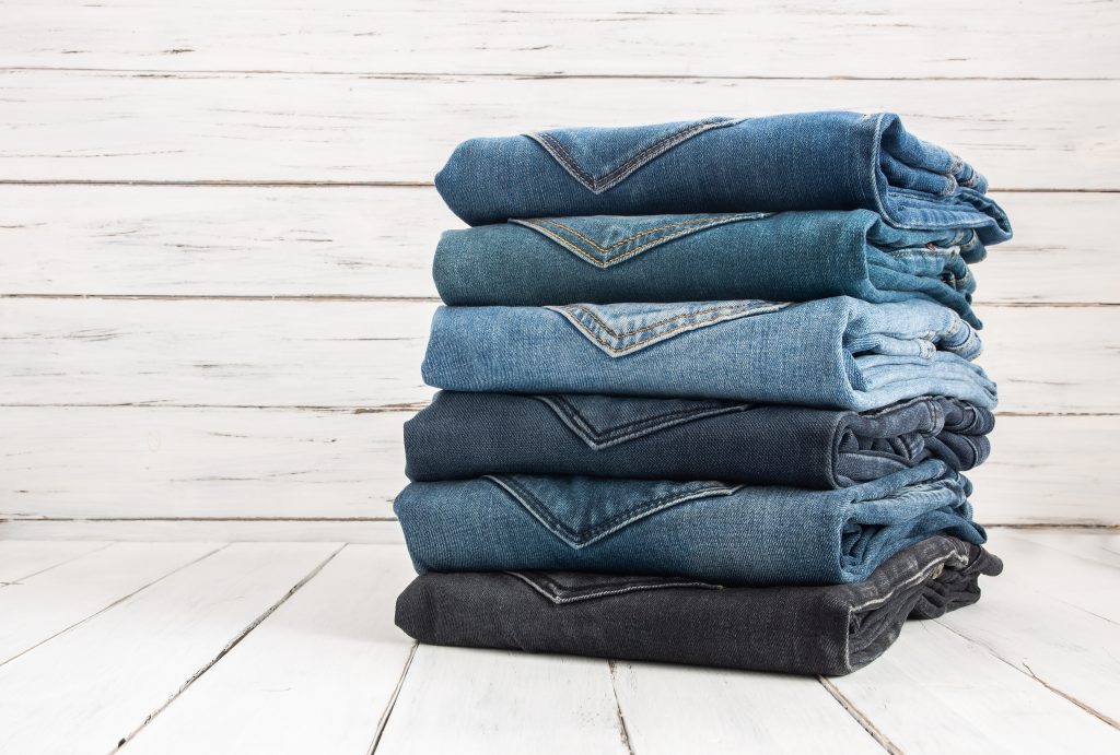 A stack of folded blue jeans.