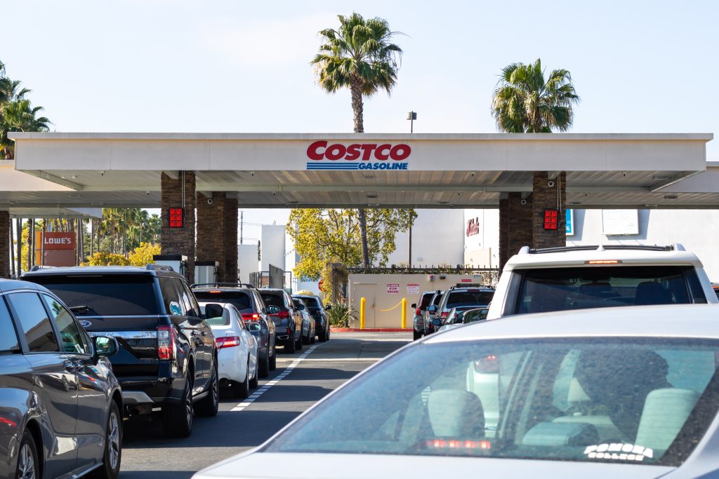 Costco gas pumps and line of cars.