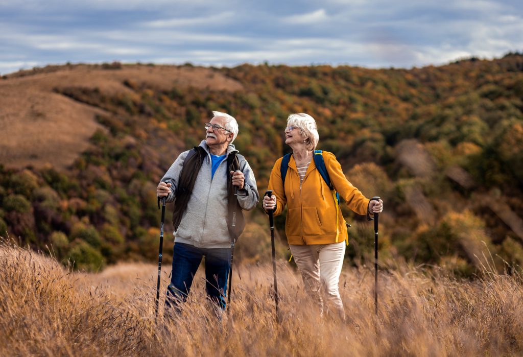 Man and woman hiking outdoors.