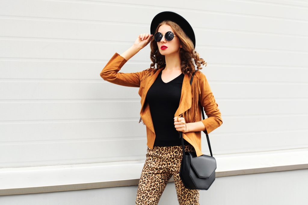 A woman waring leopard pants.