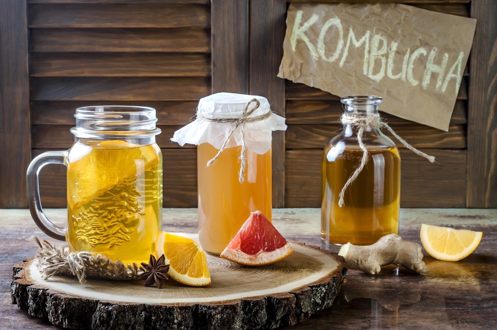 Jars and a glass of homemade kombucha.