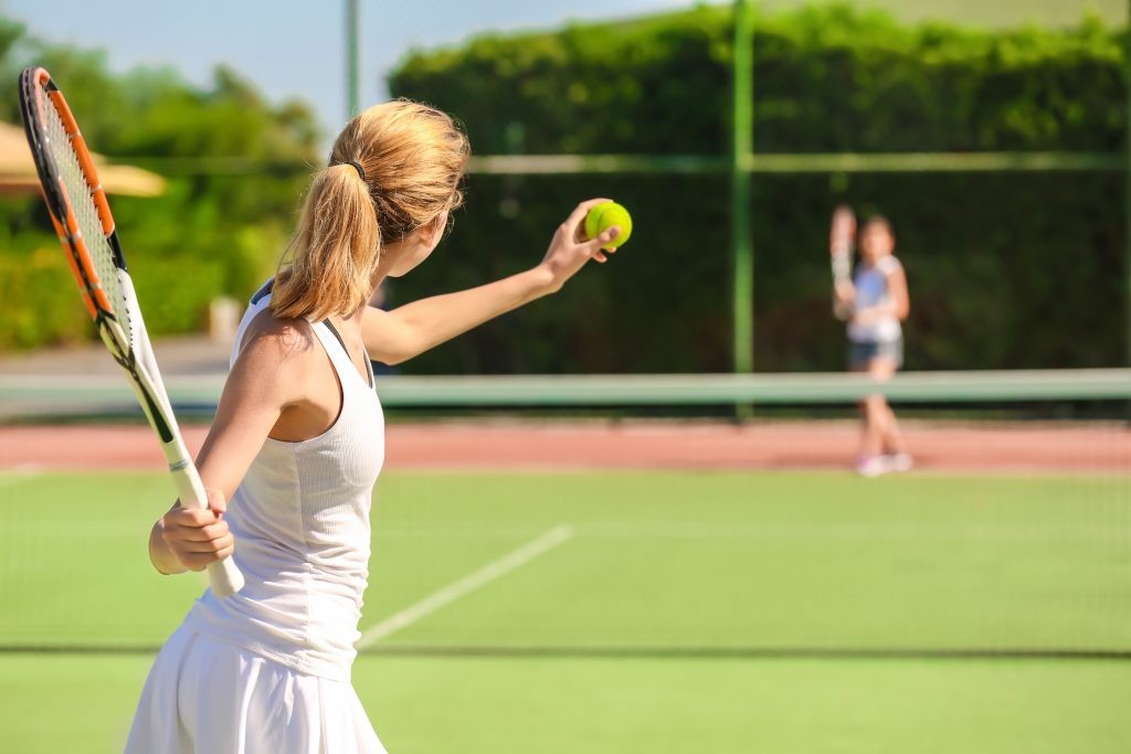 A woman playing tennis.