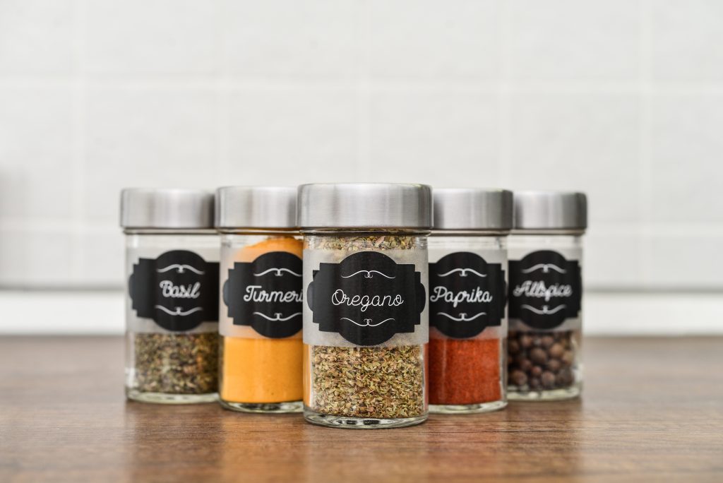Seasonings in clear jars that are labeled.