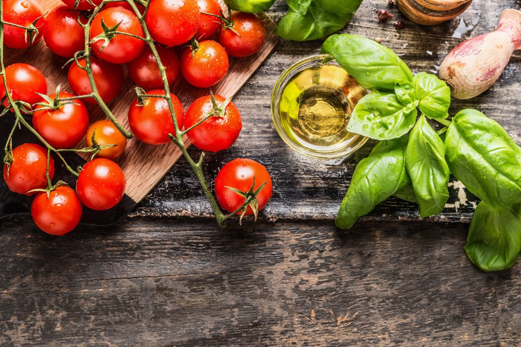 cherry tomatoes on a wood table.