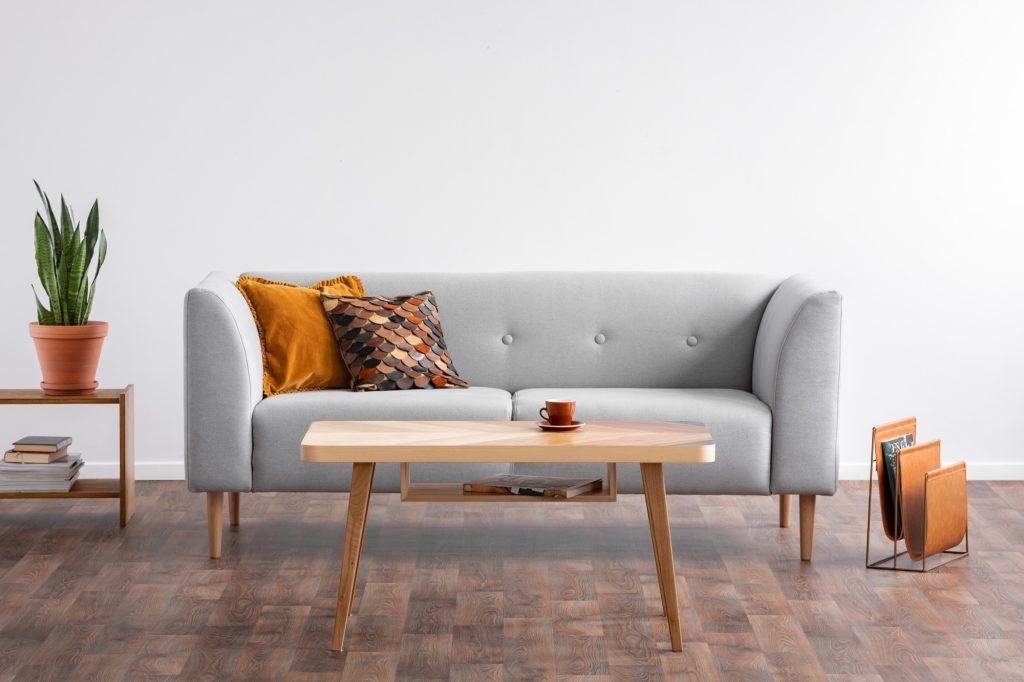 a couch with a coffee table and decor