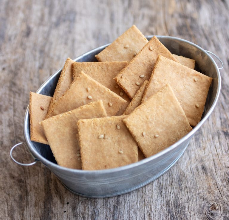 almond flour crackers in a metal container.